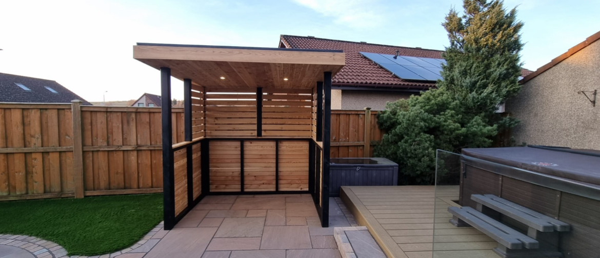 Modern garden shelter with hot tub surround and composite decking in rural Stirling