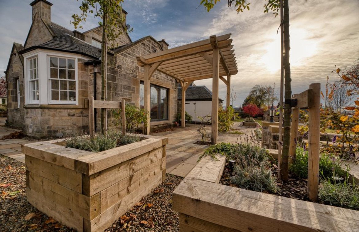 Heritage stone house pergola with raised planter beds in Edinburgh conservation area
