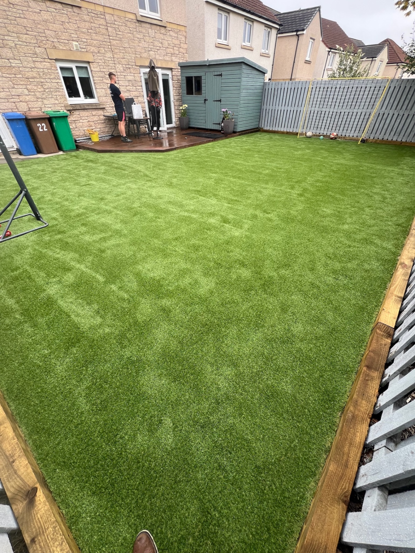 High-quality artificial grass lawn installation in Edinburgh EH postcode area showing realistic appearance and professional edging detail