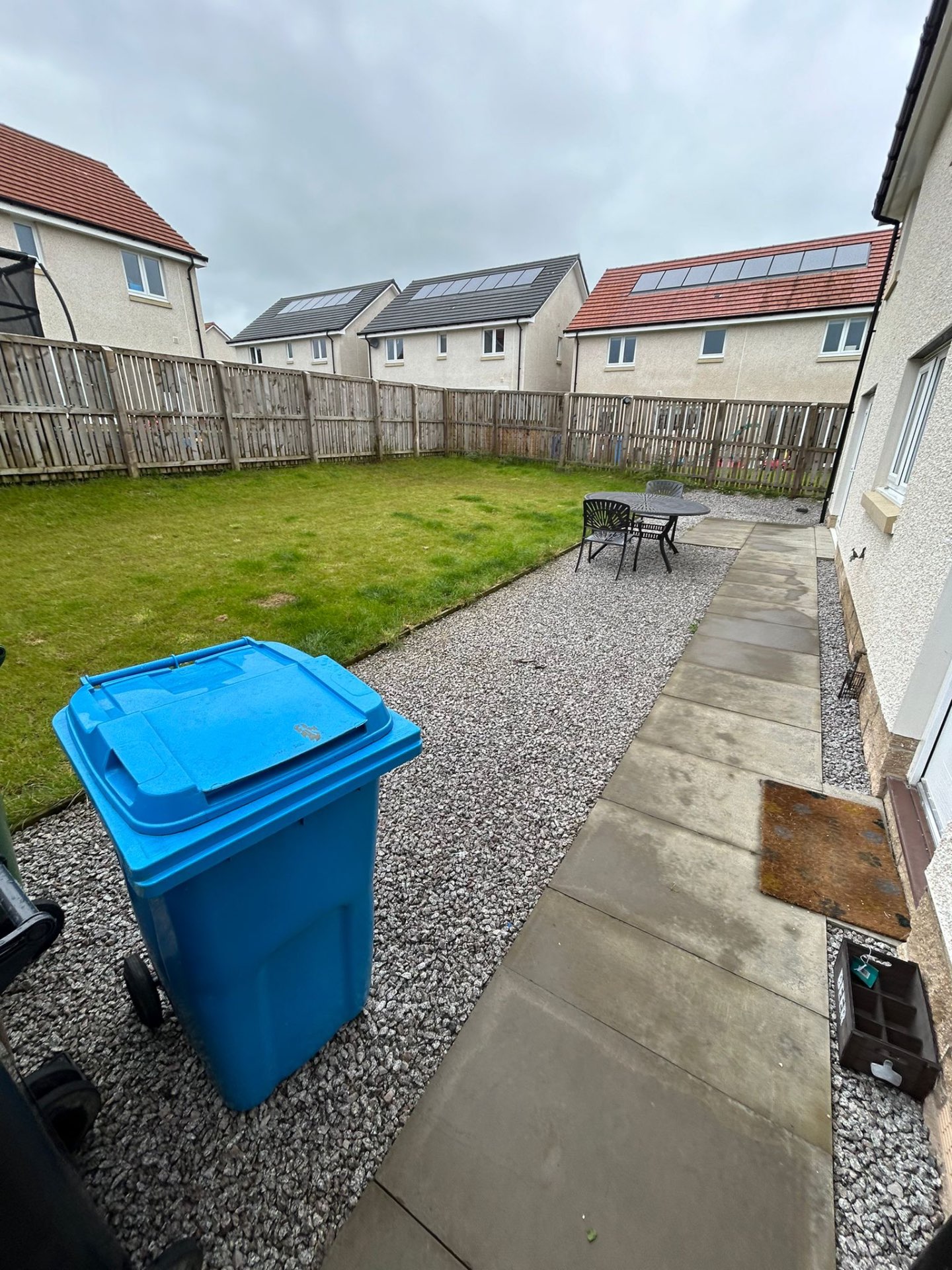 Small original patio area before garden transformation in Winchburgh newbuild property