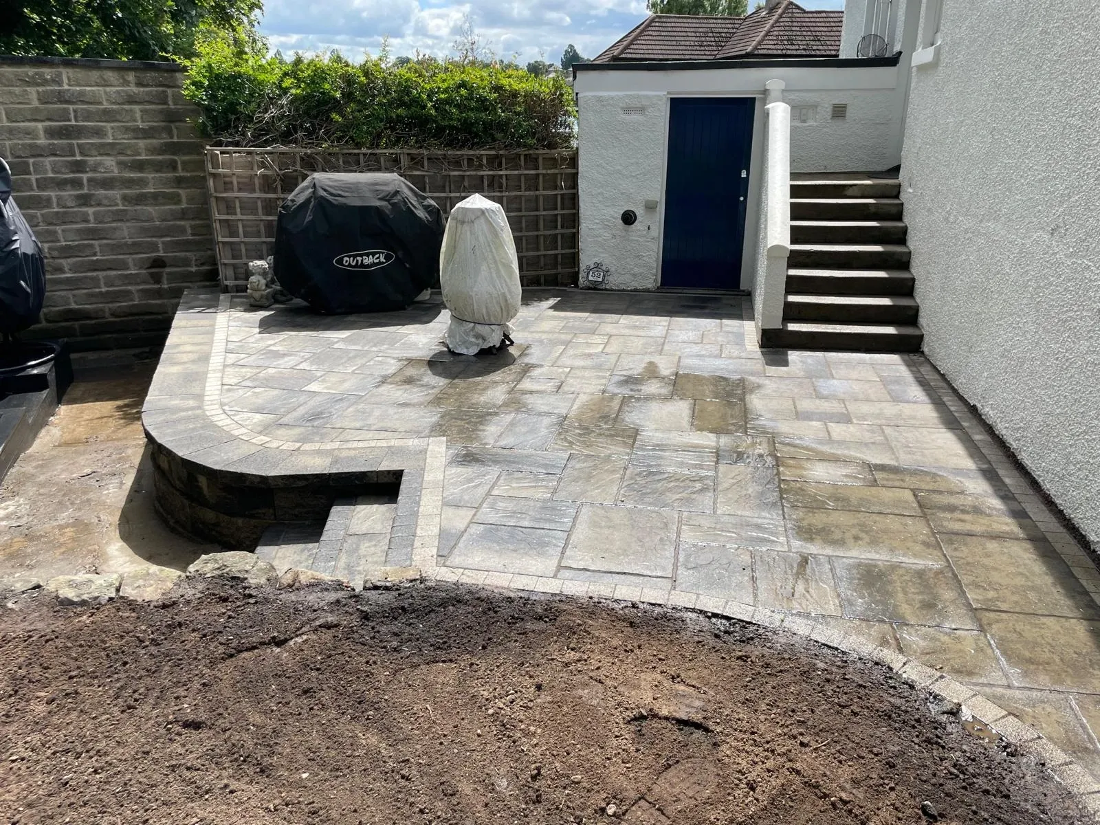 “Stunning Garden Renovation with Tobermore Walling and Historic Patio Installation | Expert Landscape Services”