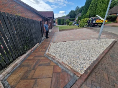 Alt Text: A stunning Tobermore driveway installation in Tullibody, Alloa. The customer opted for a captivating combination of Tobermore Shannon Heather pavers for the main driveway, complemented by a stylish graphite border. Additionally, a charming Historic Heather path completes the design, creating a visually appealing and inviting entrance to the property.